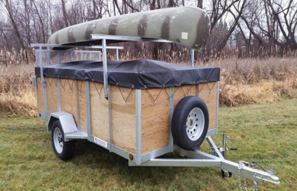 6x12 utility trailer with cover and canoe on top