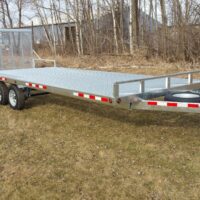 Metal flat trailer in grass